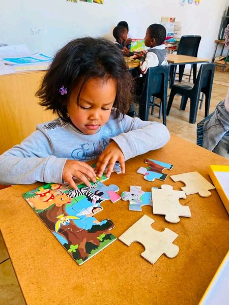 A learner completing an animal jigsaw puzzle